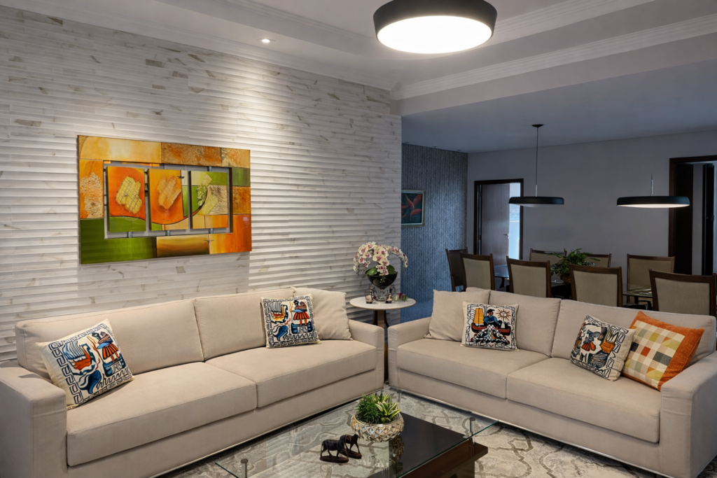Sala de estar de apartamento em Contagem no bairro Europa com sofá em L e iluminação decorativa